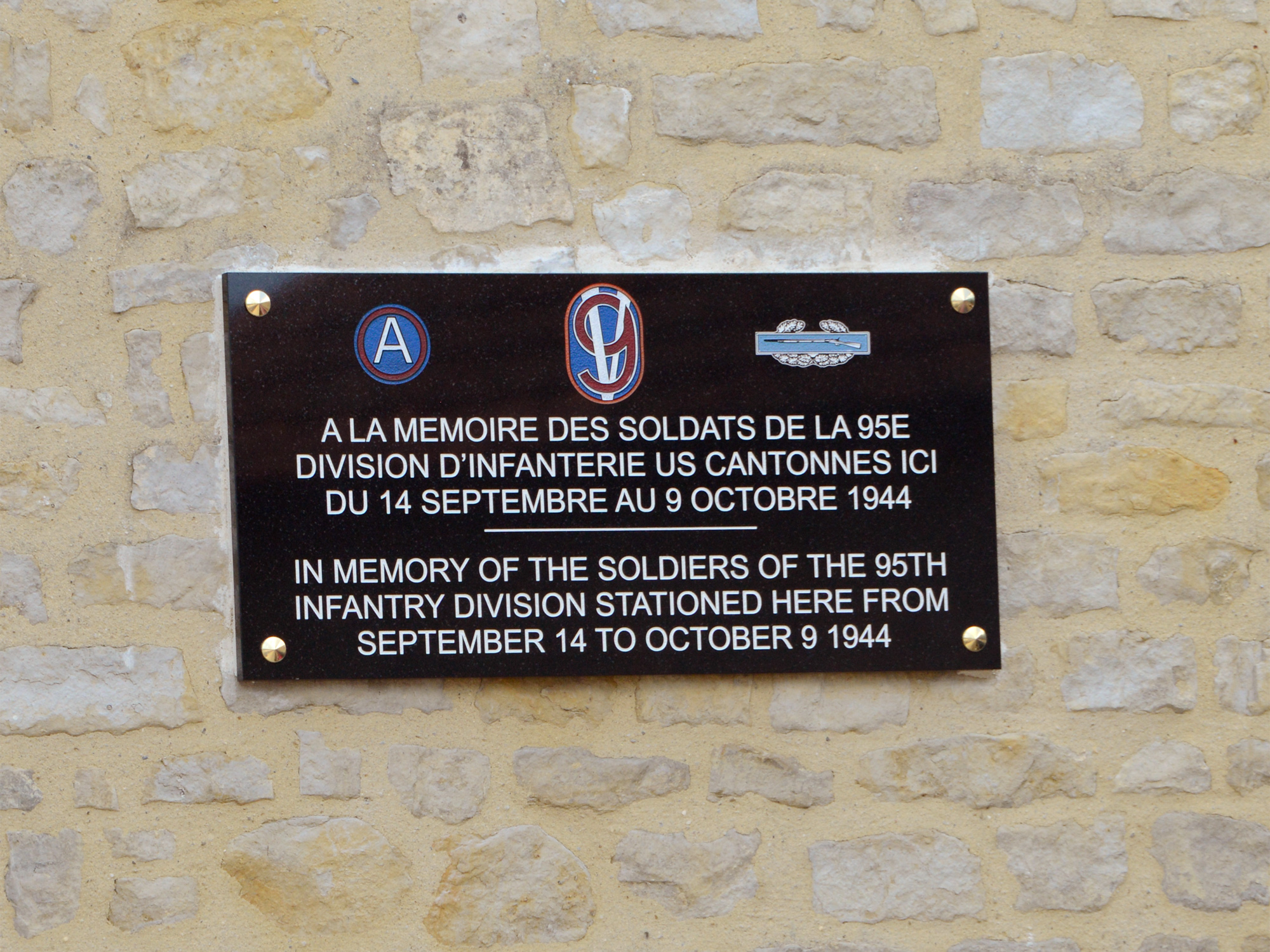 Located in Mandeville-en-Bessin, five miles from Omaha Beach, this plaque is in memory of the soldiers of the 95th ID encamped here from September 14 to October 9, 1944.