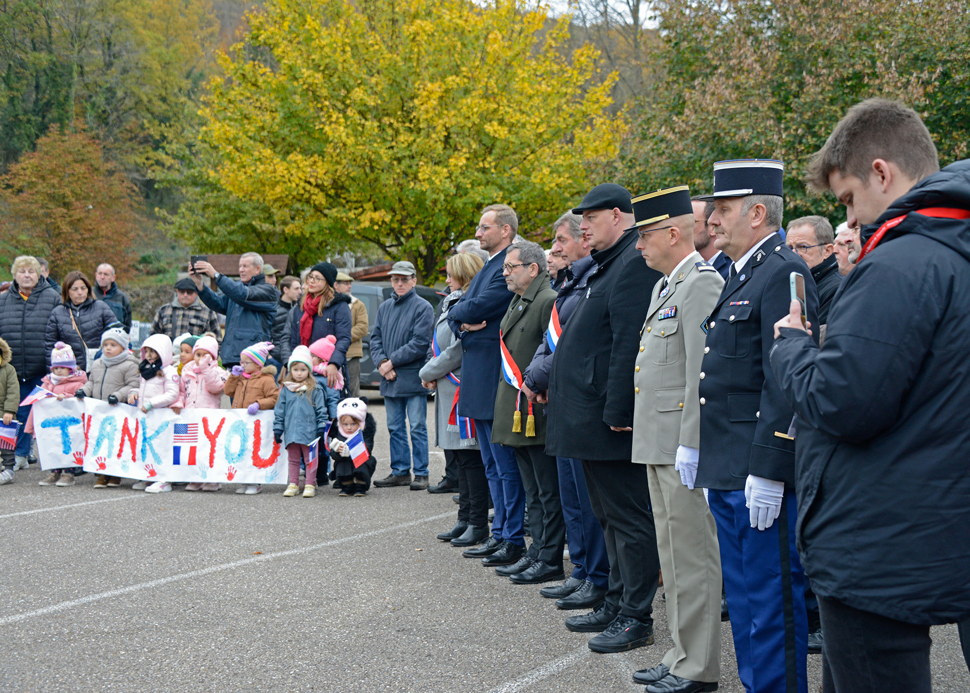 Local officials, citizens, and children gathered with the American guests for commemorations at the Joseph Mesina Memorial near Fort Hackenberg.