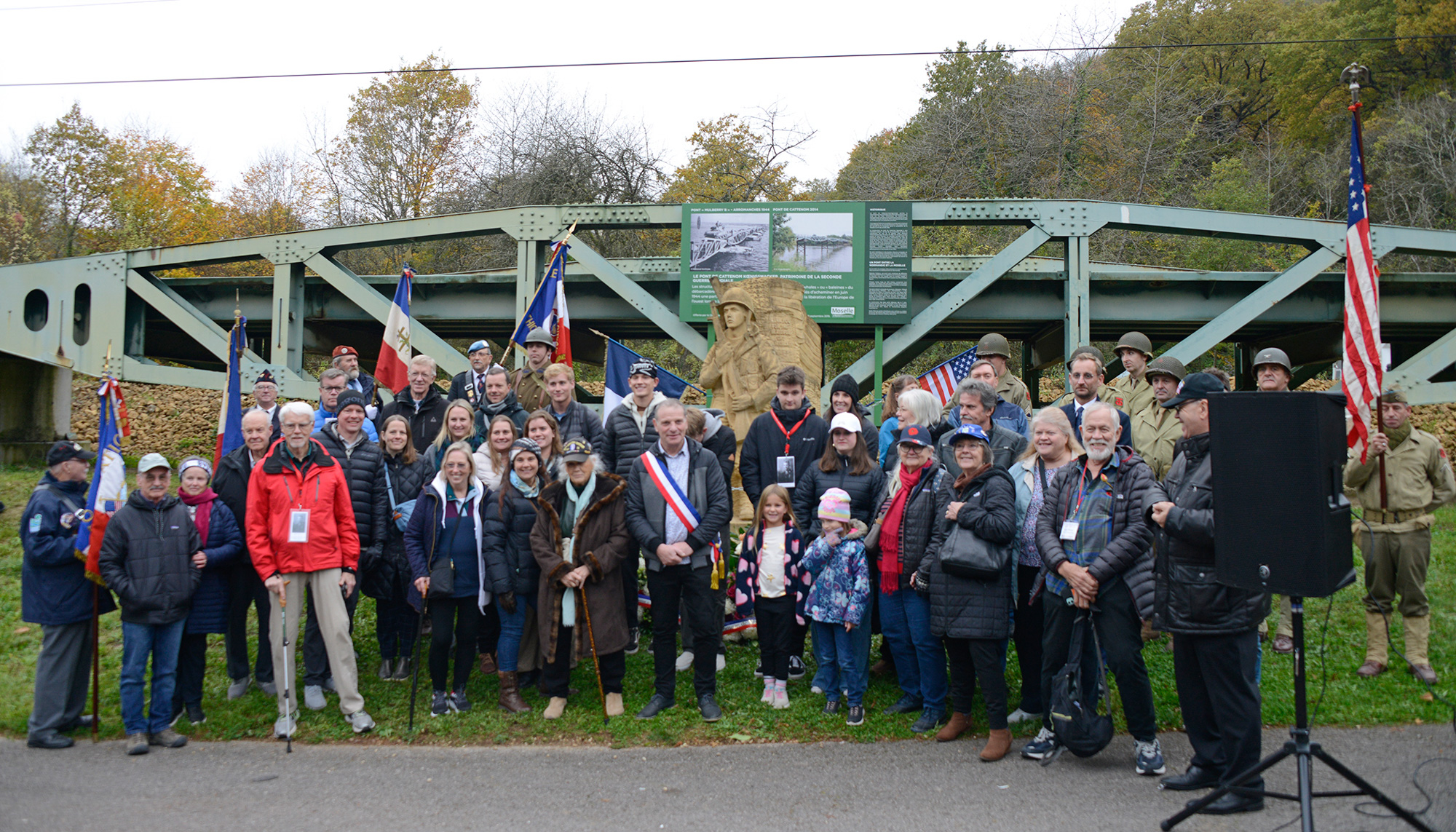 Family and friends of the 5th ID, 90th ID, 95th ID and 10th Armored Division gather for a group photo near the statue of Joseph Messina November 8, 2024.
