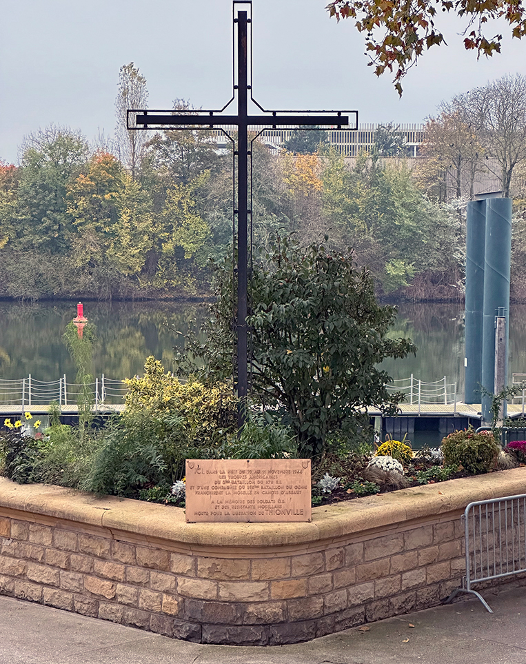 Plaque recognizing the 2nd Battalion, 378th Regiment, 95th ID and one company of the 315th Engineering Battalion at the Moselle river crossing. The 90th Infantry Division had already cleared the Germans out of Thionville and had moved on, but the Germans still controlled Fort Yutz and the east side of the Moselle. After crossing the Moselle, 2nd Battalion was faced with crossing a canal and the railroad yard as small arms fire and mortar rounds from Fort Yutz exploded around them. This was the first major combat action for the 2nd Battalion. By noon on November 13, 1944, the 2nd Battalion had taken Fort Yutz.