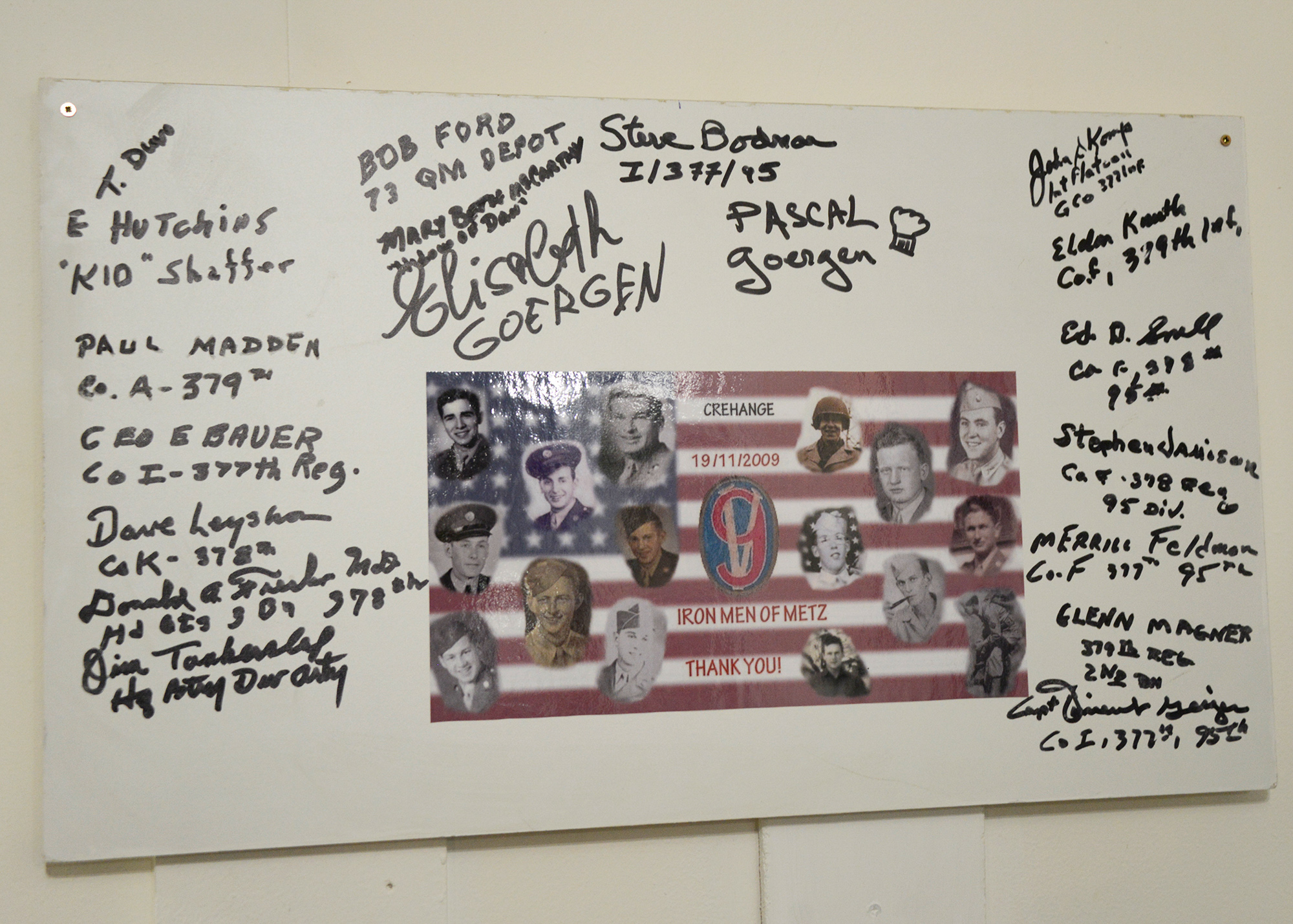 Signatures from veterans of the 95th ID and others in attendance at the 65th anniversary celebrations in Créhange, November 19, 2009, are permanently displayed in the motorpool.