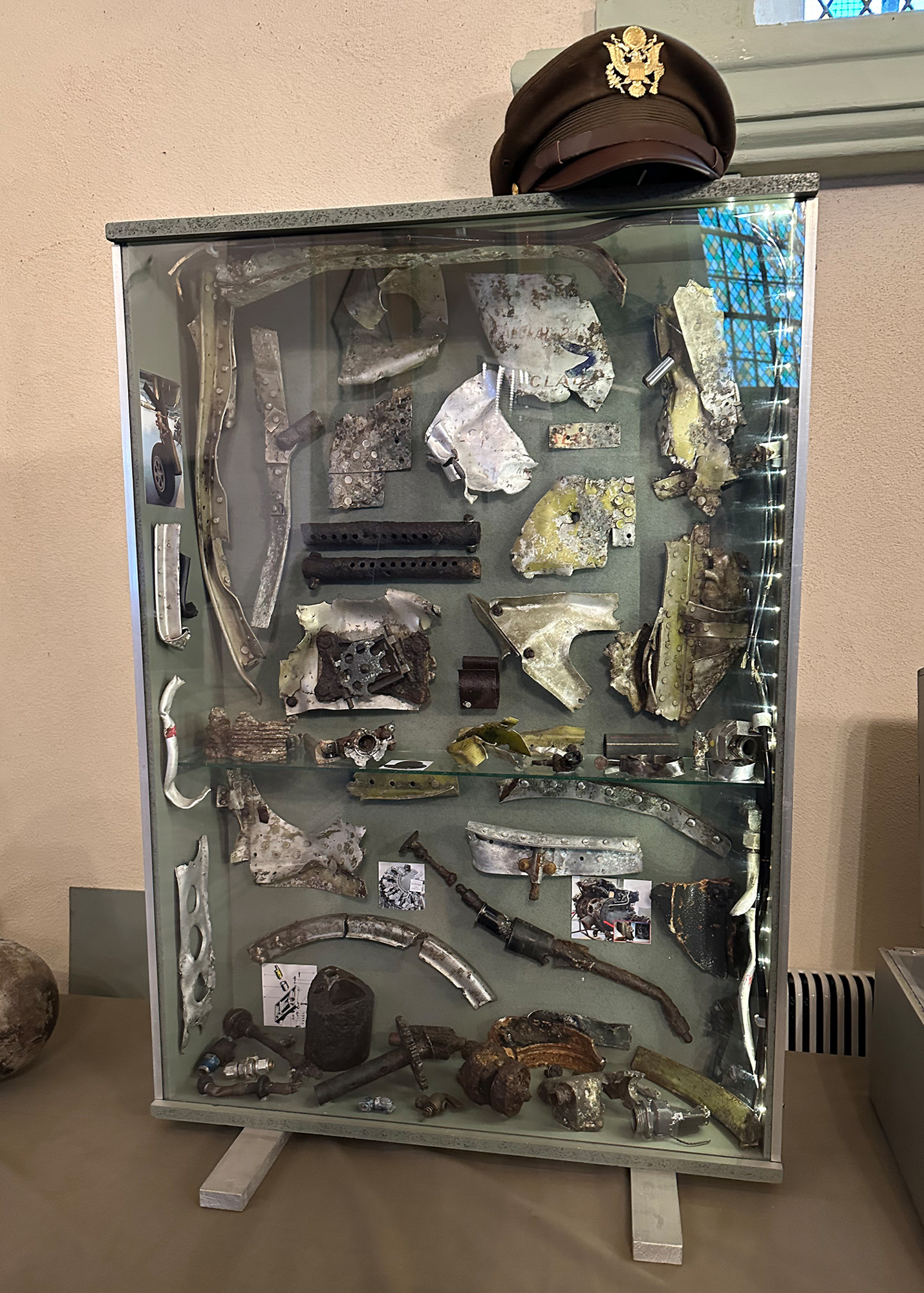 Included in the exhibition in the church was Michel Voitelet’s display of parts of a P47D he found near his home. The parts are remains from James Ryan’s crash, which killed him November 19, 1944. Michel contacted Ryan’s family in Denton, Texas, and has shared information with them. Ryan’s medals and the unopened letters his mother wrote but were not received before his death have been given to Michel by Ryan’s family.