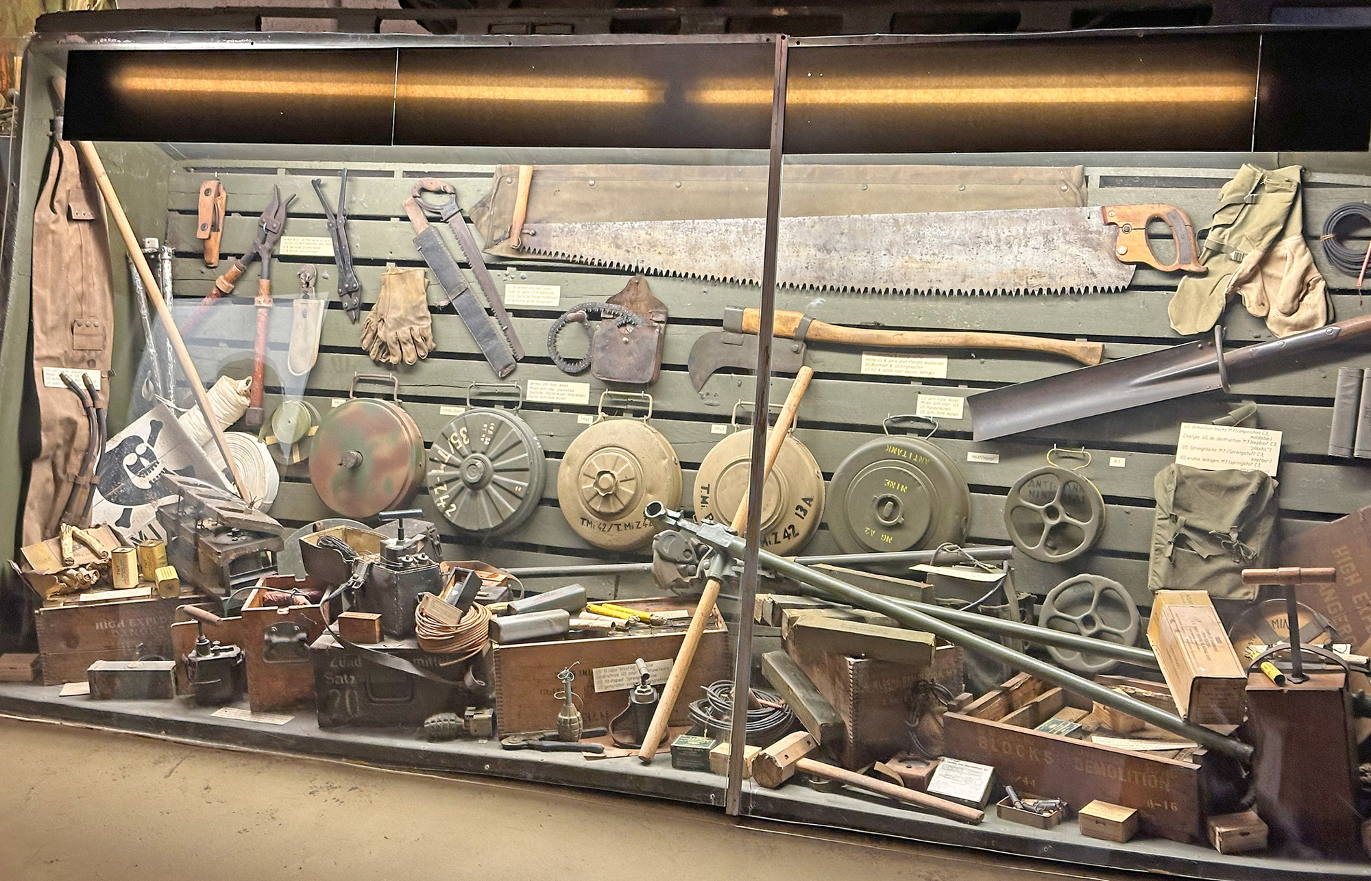 Display of American and German mines and demolition equipment.