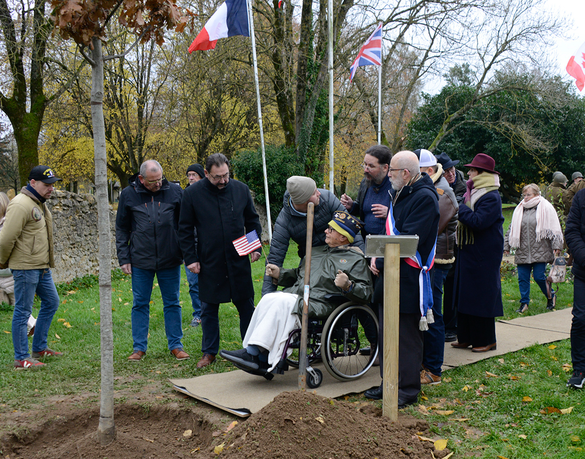 Ceo Bauer plants a tree near the ruins of Château Brieux November 21, 2024.