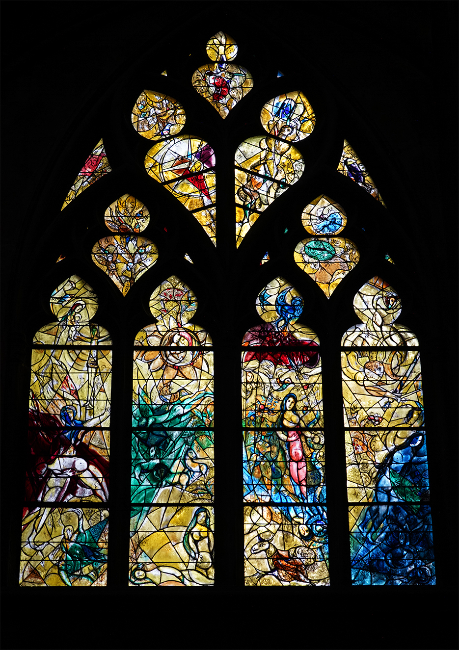 Artist Marc Chagall was a pioneer of Modernism and a master of stained glass. While in his 70s, Chagall began painting glass windows for the Metz Cathedral. This medium allowed him to create intense colors with the added benefit of natural light and refraction interacting and constantly changing—everything from the position where the viewer stood to the weather outside would alter the visual effect.