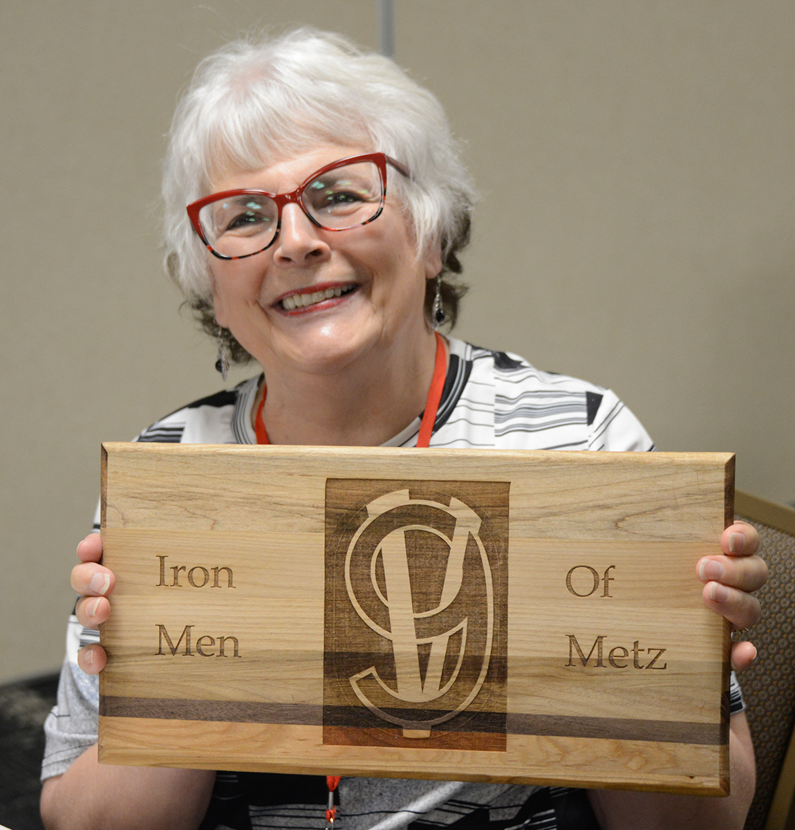 Kim Urbon's raffle prize at the Victory Belle Luncheon Saturday, May 18, was handcrafted by Ken Chang in honor of his great-grandfather, Joe Januszkiewicz, Cannon Co., 379th Reg. Ken made the wooden cutting board as a project in his wood shop class.