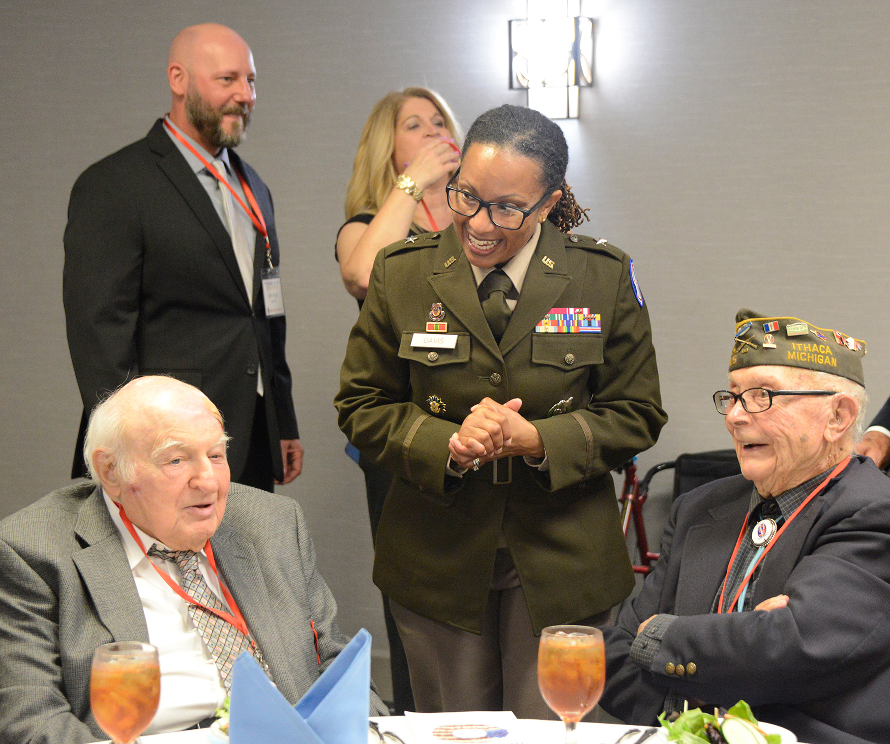 Brig. Gen. Daphne D. Davis shares a laugh with Iron Men Emil Hirsch, Anti-Tank, 378th Reg., and Ceo Bauer, I Co., 377th Reg. at the Saturday, May 18, Formal Banquet.