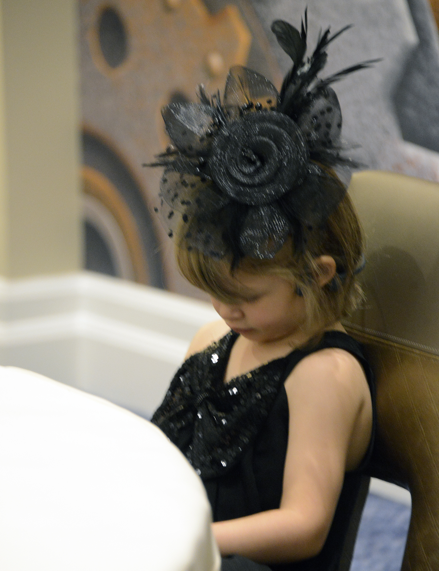 Dressed in her finest, Col. Jennifer Mack's granddaughter takes a quiet moment before the Formal Banquet.