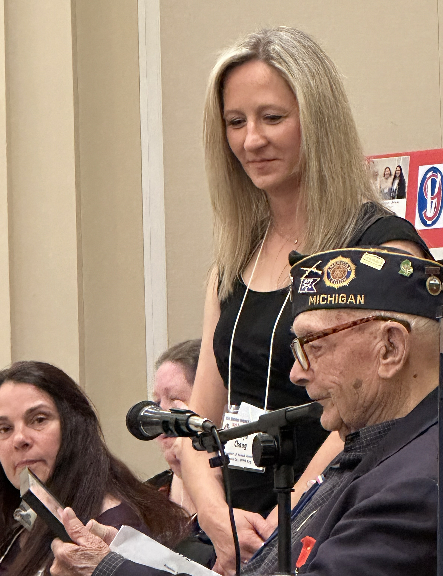 Tanya Chang receives an honorary certificate from Ceo Bauer.