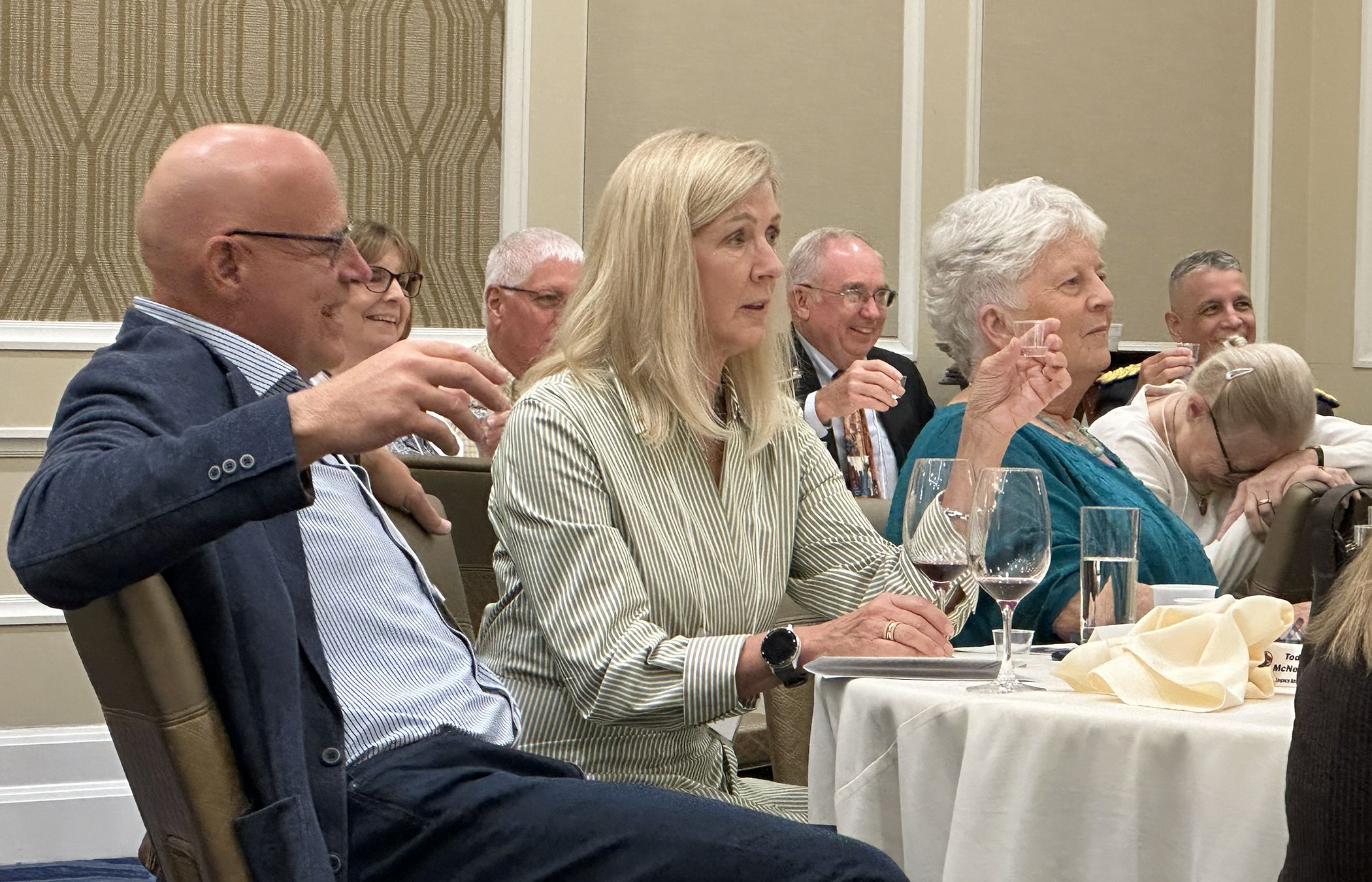 The crowd reacts to Ceo Bauer's Mirabelle Toast.