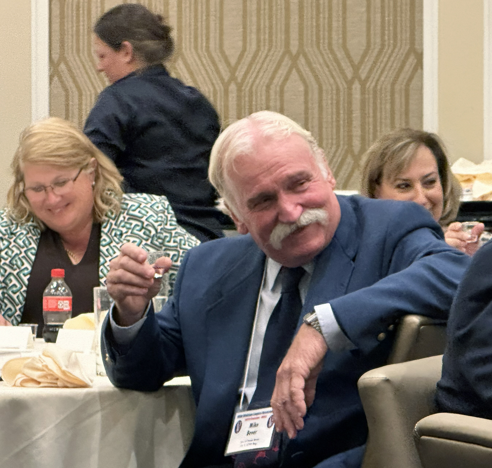 Kristin Whittington, Mike Bever and Kelly Curll listen to Ceo Bauer's lengthy Mirabelle Toast at the Formal Banquet.