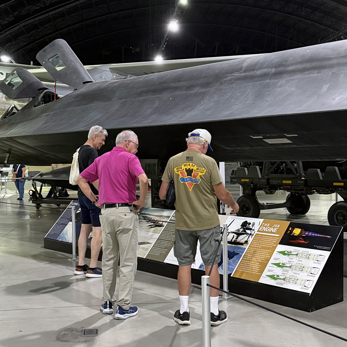 Jim Broadway, Mike Flora and Mike Bever read the specifications on the SR-71, Aug. 20, 2026, at the National Museum of the United States Air Force in Dayton.