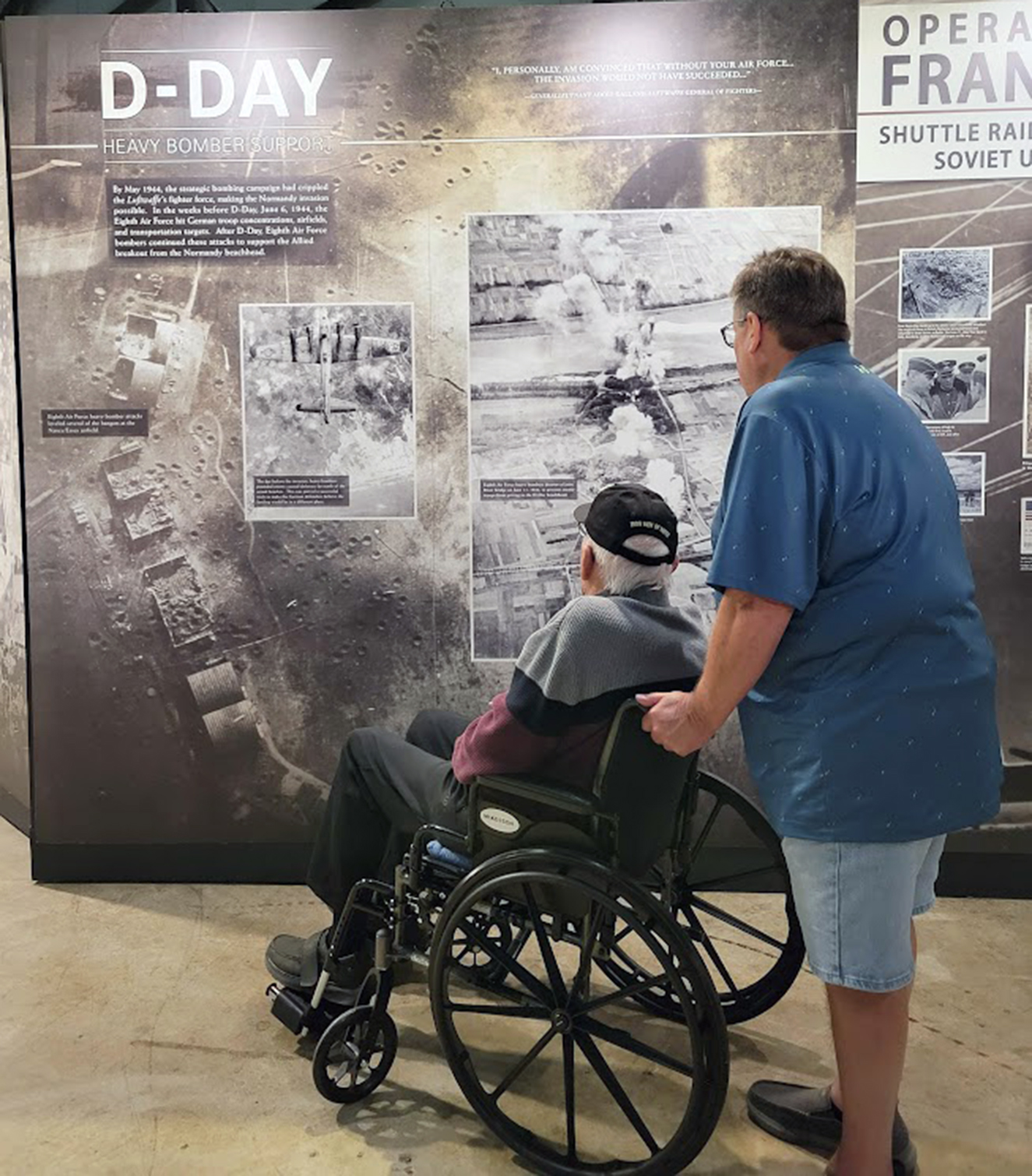 During their visit to the U.S. Air Force museum, Iron Man Jim Walker and his son-in-law, Tim Howman, examine a map of the invasion in Normandy, June 6, 1944.