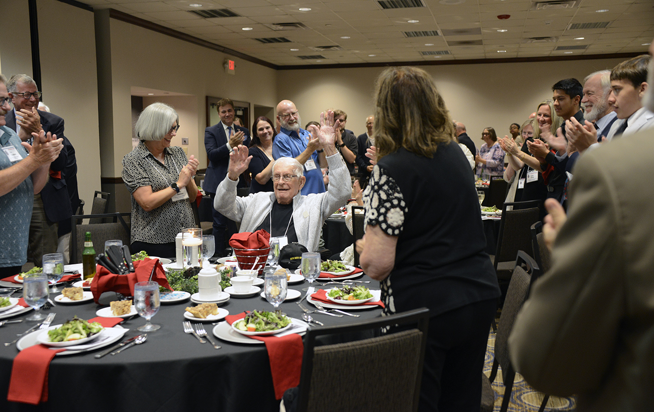 Iron Man Jim Walker is introduced at the Formal Banquet . Eighteen members of the Walker family attended the banquet held Saturday, Aug. 22, 2026.