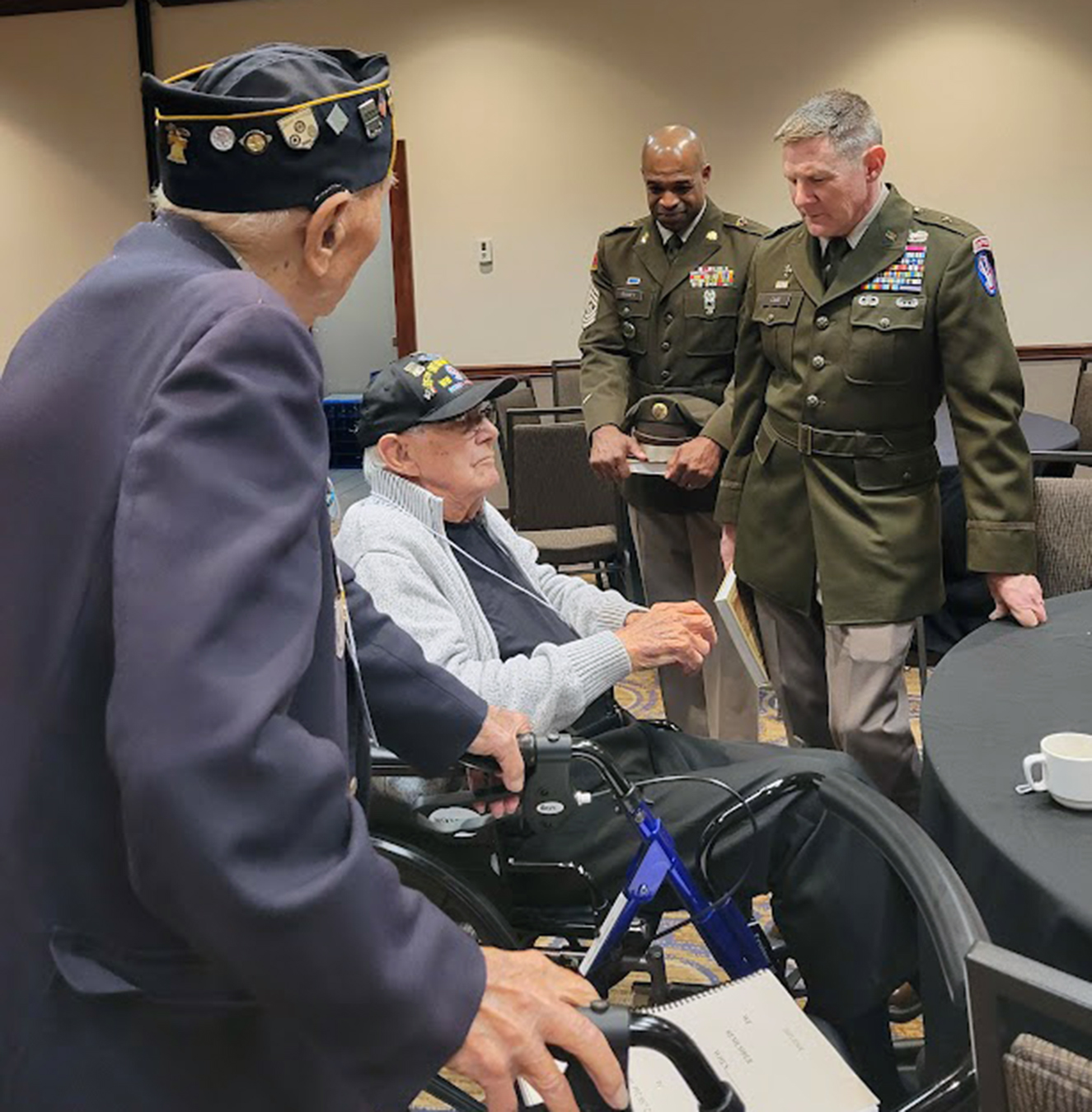 Ceo Bauer and Jim Walker, both veterans of I Co., 377th Reg., talk with CSM Raney and BG Case following the Formal Banquet, Saturday, Aug., 22, 2026.