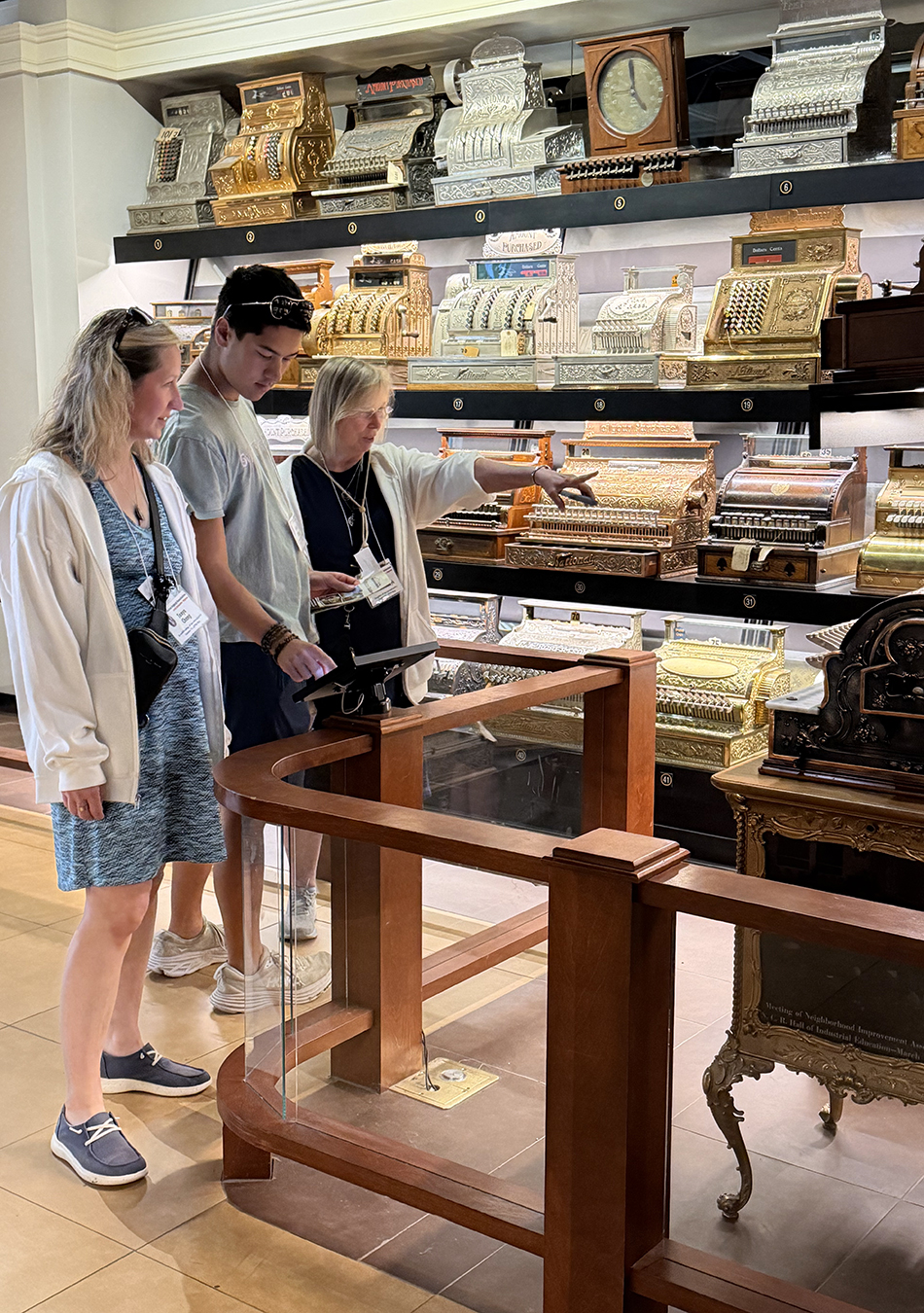 Tanya Chang, Kevin Chang and Kim Kowalczyk check out the NCR exhibit at Carillon Historical Park Friday, Aug. 21, 2026.