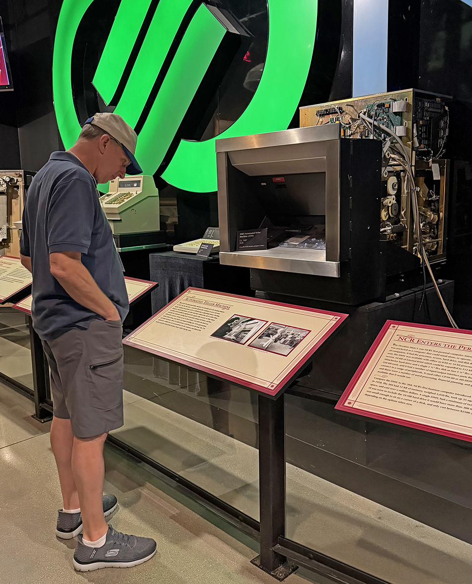 While touring Carillon, Bill Soderberg reads about National Cash Register’s invention of the teller machine in Dayton.