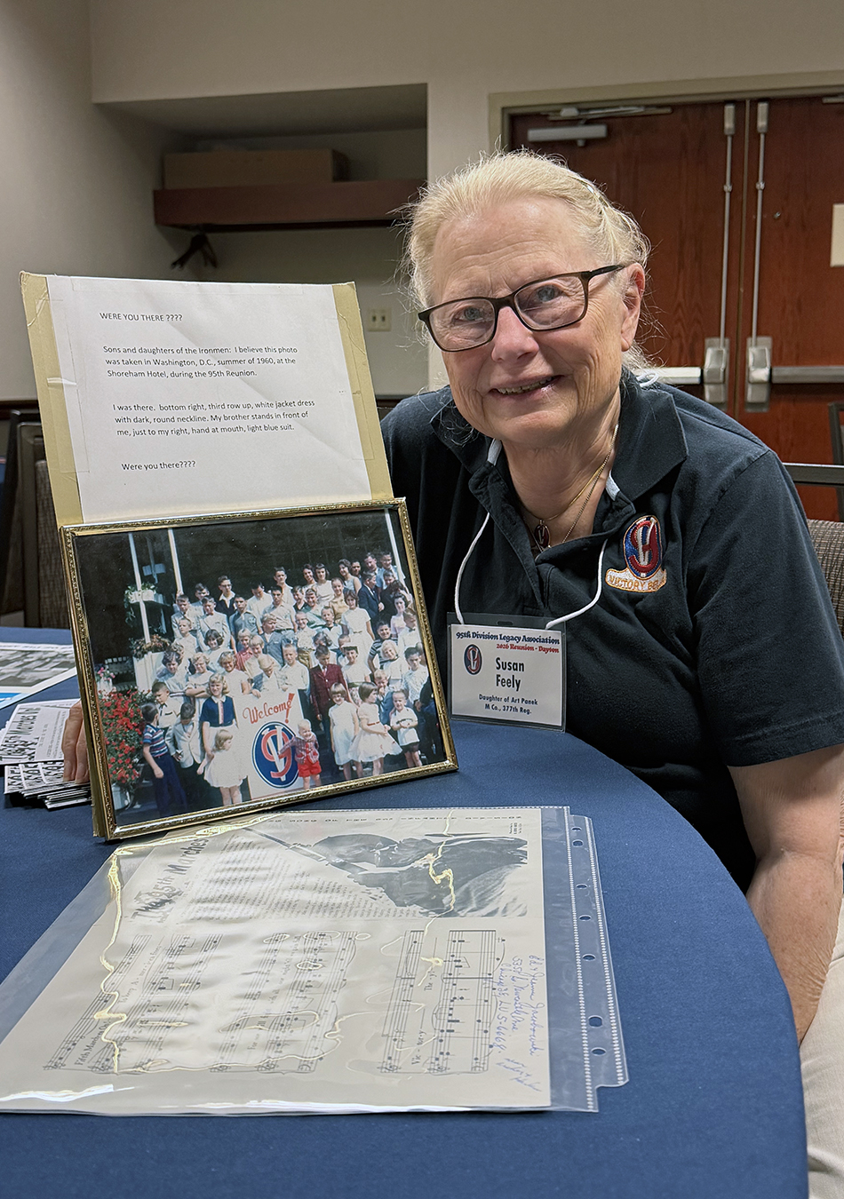 Susan Feely remembers family vacations were planned around 95th reunions during her childhood. She brought a photo of the children of Iron Men taken in 1960 at the reunion in Washington, D.C. Susan is the blonde pictured at the bottom right, third row up with the white jacket dress.