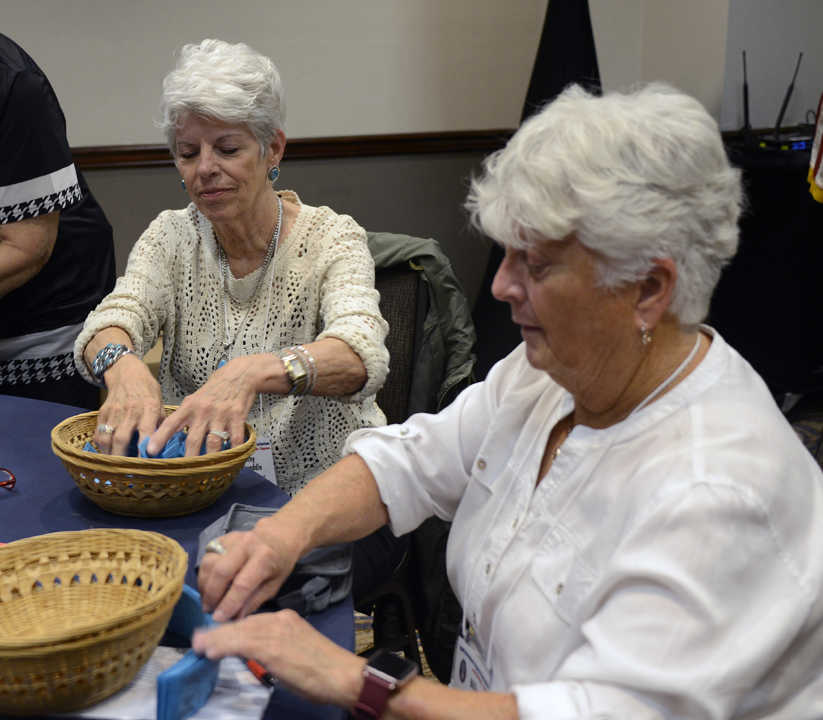 Kathy Twaddle and Billie Bauer sell tickets for the annual Victory Belle raffle.